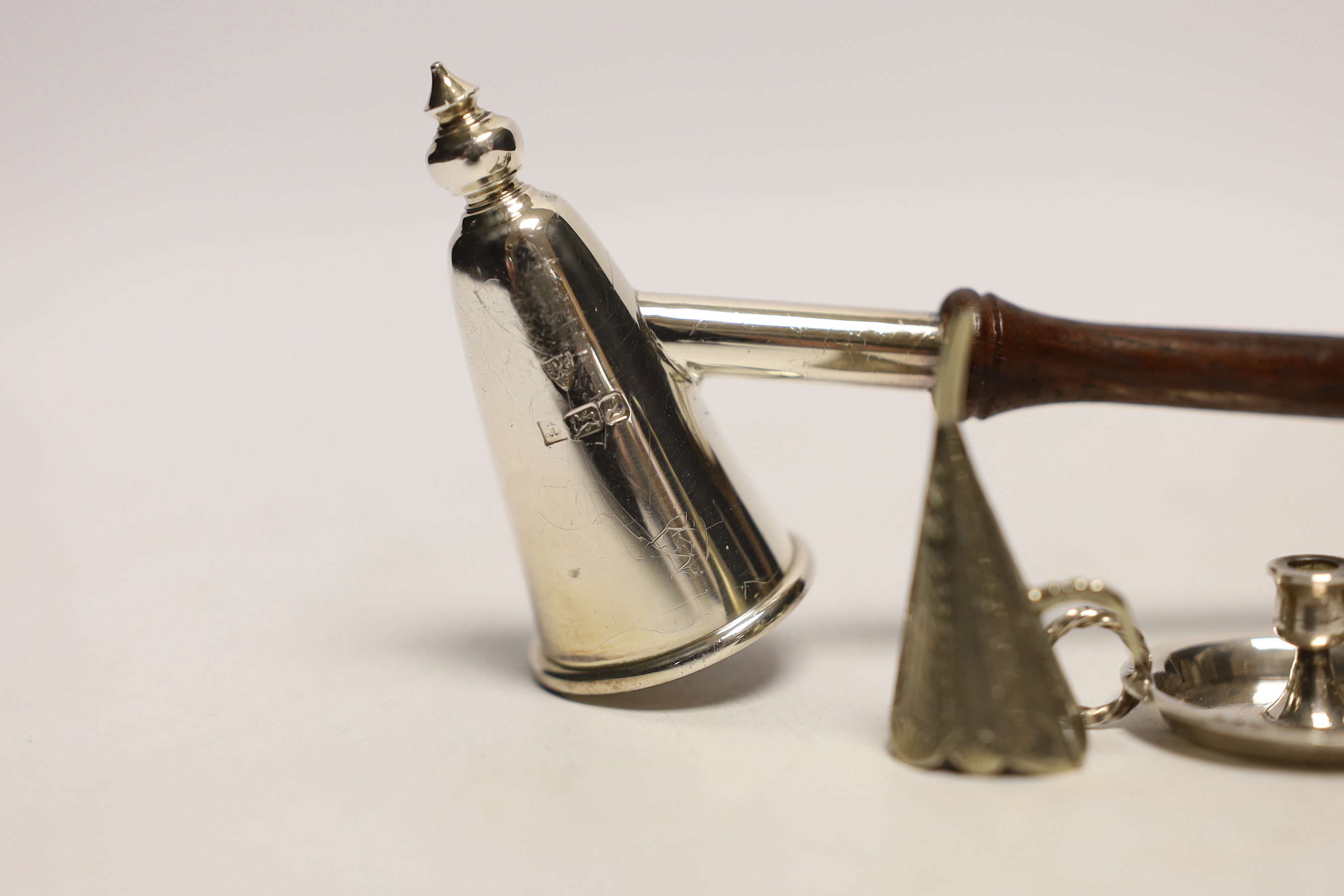 A George IV silver chamberstick, of leaf form, Birmingham, 1829, with associated unmarked extinguisher, together with a late Victorian miniature silver chamberstick, by William Comyns, retailed by Child & Child, a modern